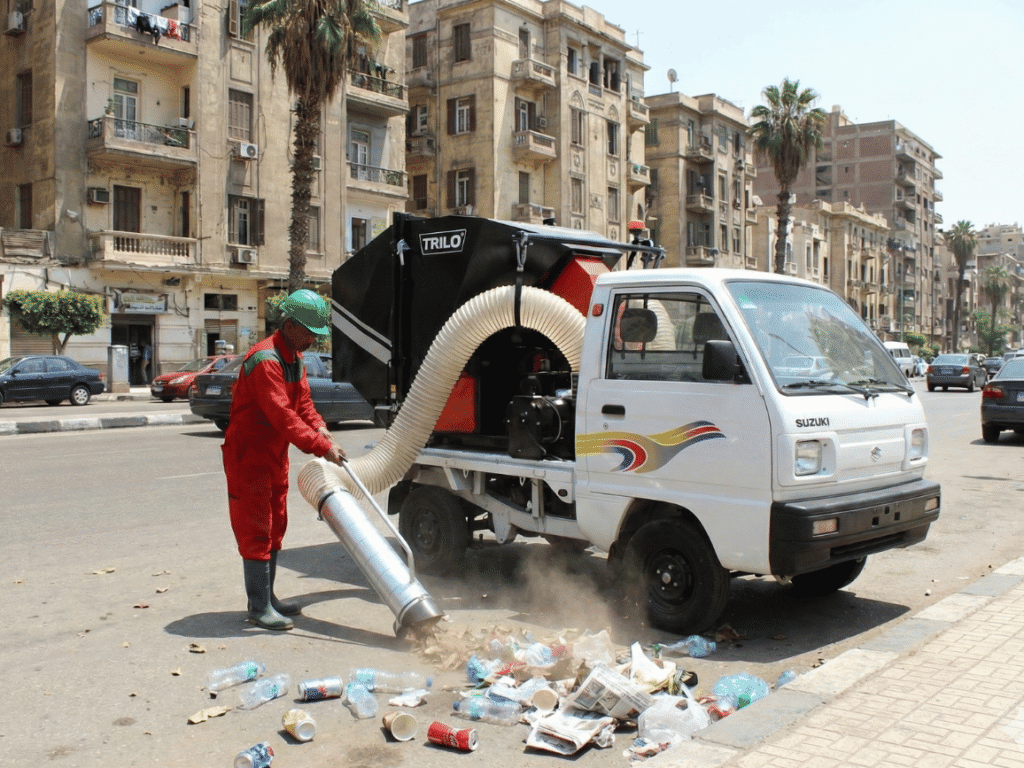 TRILO T1 vacuum waste collection unit collecting waste from a street